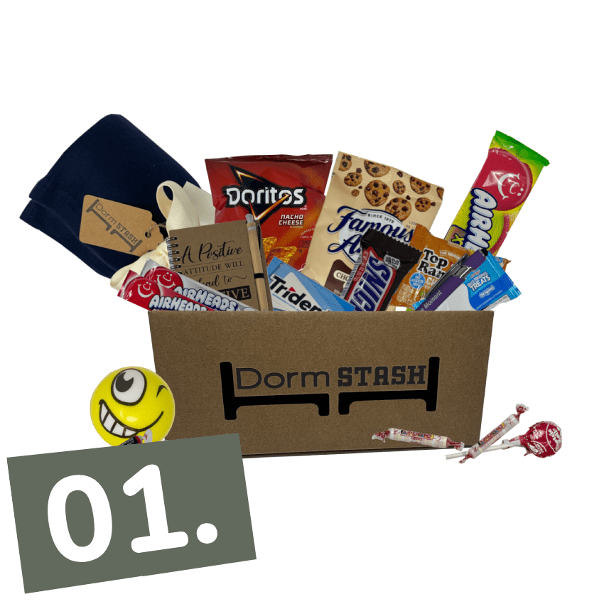 A Dorm Stash box filled with snacks, a blanket, a stress ball, and other small items, with the label "01." in the bottom left corner.